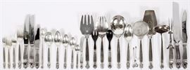 Lot#1072, GEORG JENSEN "ACORN" STERLING SERVICE, 183 PIECES. The sterling service includes 17 place forks, L.8", 12 salad forks, 12 lunch knives, 12 butter spreaders, 18 teaspoons, 12 soup spoons, 12 luncheon  forks, L.6 5/8", 12 ice tea spoons, 12 seafood forks, 12 demitasse spoons, 12 oval soup spoons, 6 grapefruit spoons, 4 serving spoons, 18 place knives, L.10", 1 carving knife and 1 carving fork, 1 bread knife, 1 gravy ladle, 1 sugar tong, 1 salad fork and 1 salad spoon, 1 relish fork and 1 relish spoon, 1 pie server, 1 fish serving fork and 1tomato server.  A total of 183 pieces.  Weighs approximately 193.1 troy ounces, weighable.
