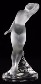 Lot#1233, LALIQUE CRYSTAL FIGURE, H 9.5", DANCER.Signed Lalique, also Lalique label and France. Clear frosted Lalique crystal designed by Marc Lalique in 1960. "Danseuse Bras Baisse" which means "Dancer with Lowered Arm".