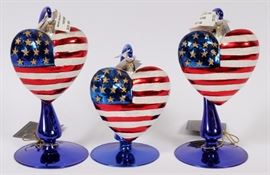 Lot#1277, CHRISTOPHER RADKO GLASS CHRISTMAS ORNAMENTS.Including 4 glass, "Braveheart" flag heart form ornaments, W.5"; together with 11 glass and gold tone metal ornament holders. ( 4 of the holders are gold tone, 1 is red glass and 6 are blue glass).   15 pieces total.