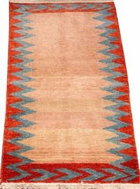 Lot#1406, TURKISH HAND WOVEN WOOL RUG, BY WOVEN LEGENDS WEAVERS W 2' 5'', L 4'Having a dark ivory field with a red and pale blue border.