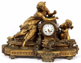 Lot#2067, GUICHE PALAIS ROYALE FRENCH BRONZE MANTLE CLOCK 19TH.C. H 21" L 28"Depth 10". Works impressed "Guiche, Palais Royale" #147. Case FF #1398. Enamel dial with Roman numerals. Allegorical figure reclining on clock leaning towards cherub.