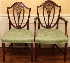 Lot#2095, ENGLISH HEPPLEWHITE MAHOGANY DINING CHAIRS, C. 1785, SET OF EIGHT.Including 2 armchairs and 6 side chairs; each has a shield-form back with carved wheat design, raised on square tapering legs joined by stretchers.  Provenance: Stair & Co., New York, NY, purchased in October 1983.