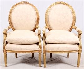 Lot#2226, FRENCH STYLE LOUIS XVI GILT WOOD ARMCHAIRS, PAIR, H 40", L 25"Having ivory floral damask upholstery, padded arms, floral carving and down cushions.