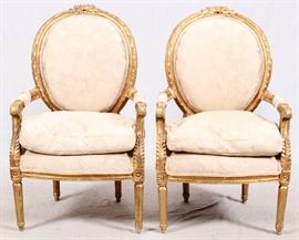 Lot#2227, FRENCH STYLE LOUIS XVI GILT WOOD CHAIRS, PAIR, H 40", L 25"Having ivory floral damask upholstery, padded arms, floral carving and down cushions.