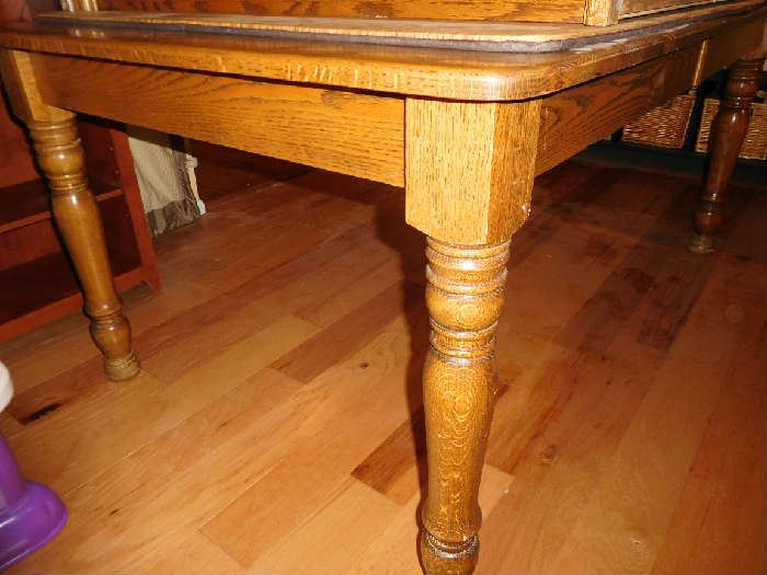 legs  of  oak  table  that  matches  buffet  and  there  are  7  chairs  not  pictured