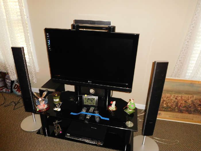 flat  screen  tv  and  stand   with  surround  sound