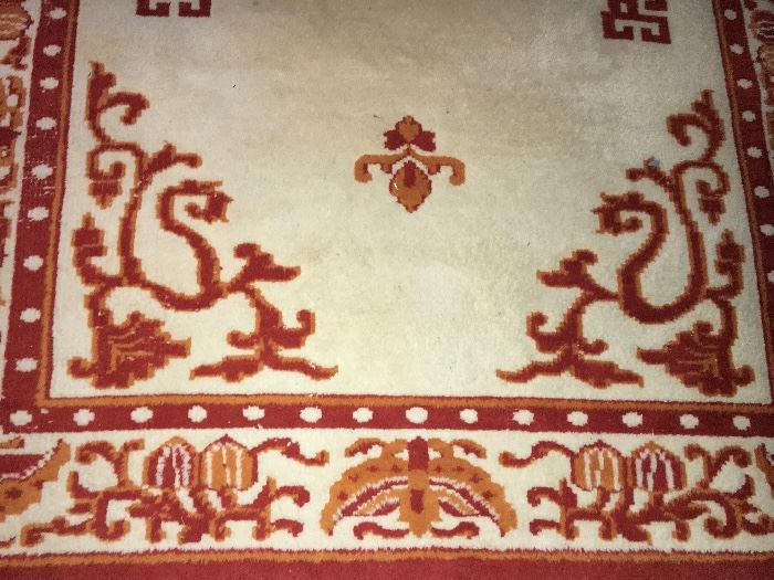 Assorted vintage rugs.