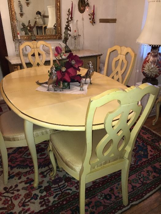 Vintage white drop leaf table and 6 chairs.