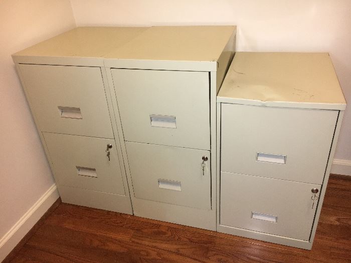 3 metal file cabinets with keys.