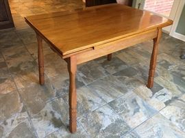 Solid maple vintage kitchen table with pull out leaves.