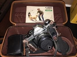 Canon AE-1 camera with 2X lens and bag.