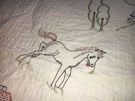 Adorable vintage baby/child quilt with charming hand-embroidery.