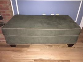 Large velvet ottoman.