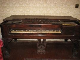 Rosewood box grand piano.