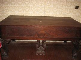 Rosewood box grand piano.