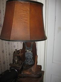 Shoe cobbler tools made into a lamp.