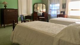 Pair of Twin Beds; Mahogany Tester Beds , Circa 1930’s; Converted oil lamp; Mahogany Dresser and Dressing Table with 3 part Mirror and Bench; Sewing Rocker & Sewing Caddy; Singer Sewing Machine & Matching Stool