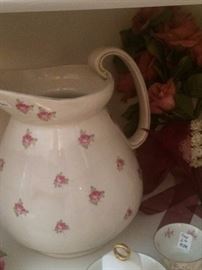 Antique pitcher with pink roses