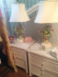 White wicker headboard, matching nightstands, and precious identical lamps