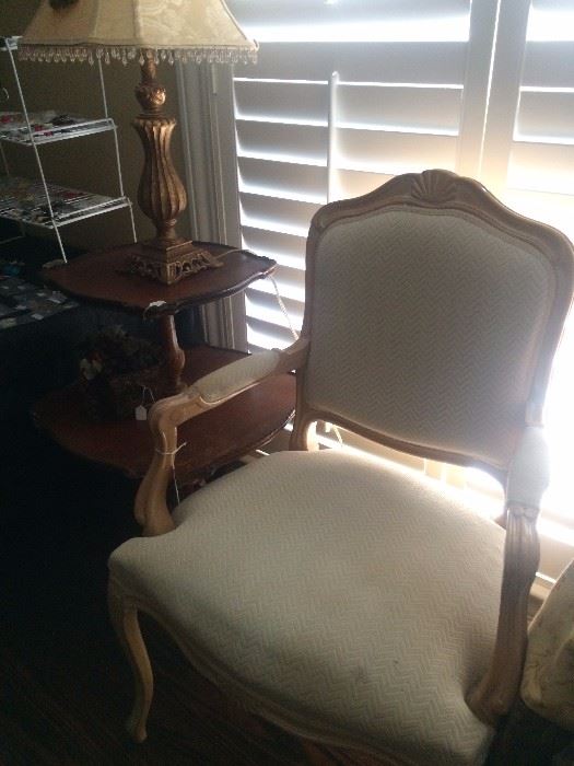 French provincial chair, tiered table, and lamp