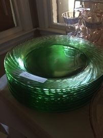 Green plates that can be used as chargers.