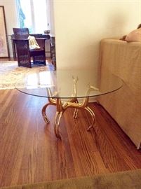 Art Deco or could be Hollywood Regency Solid Brass Base with Glass top. The stand are Antelopes or Deer. This piece is so unique!