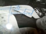 signature of who band member on photo