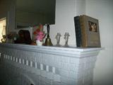 Wall mirror, mantle,Bibles,candlesticks,Westminster clock,oil lamps