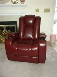 This is such a great comfy chair.   It is a power recliner and even the piece in the back middle is adjustable.  Leather and even has cup holders.  Excellent condition!  Arms lift up for more storage.  Sit back, relax, enjoy your favorite beverage and watch a movie!