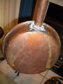 Primitive copper bed warmer