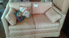 Coral colored loveseat