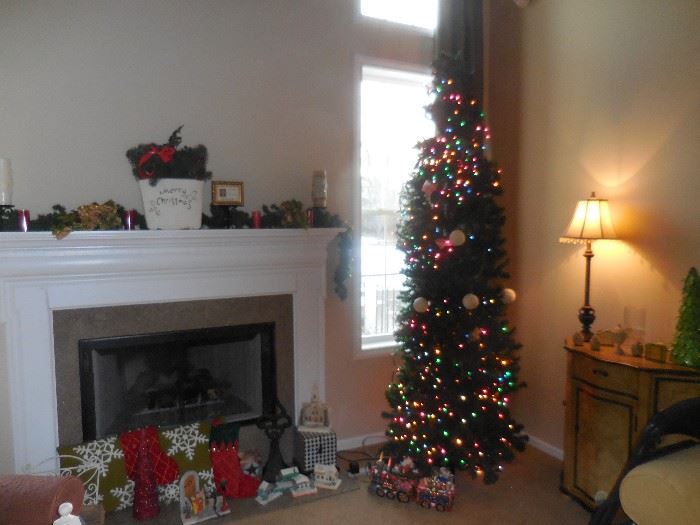 We are ready for the Holiday Season!! 8 Ft Lighted (we put the lights on for you!!) Christmas Tree. Mantel Decorated for Holiday