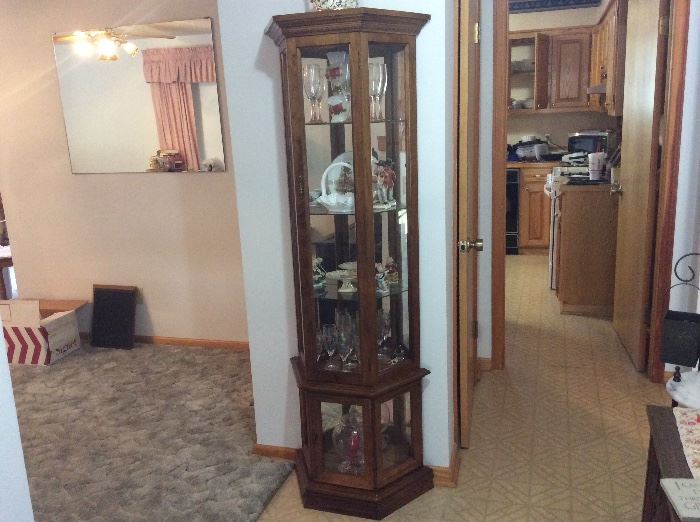 Curio cabinet full of collectibles