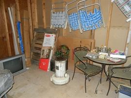 lawn chairs, heater, pallet, tv, lawn chairs, table & chair set.