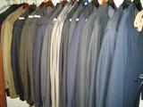 Dozens of Men's designer suits size 42-44 by Zegna, Boss, Aboud and others.