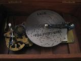 Thorens Music Box with dozens of metal discs.