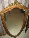 Antique shield shaped mirror.