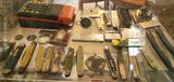 Collection of pocket knives and straight razors.