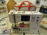 Bernina Artista with loads of accessories.