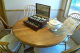 Oak dinette set. 2 sets of silver plate flatware.