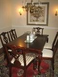 Chippendale style dining table w/8 chairs, 2 leaves and table pads all in perfect condition.Turkish 8" x 11" wool rug.