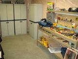 Plano storage cabinets. Lighted Work bench with Craftsman tools etc.