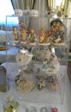 A large selection of Dresden Lace figurines and a Hummel collection.