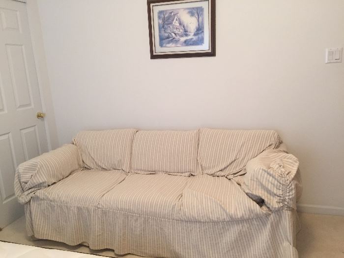 Sofa with Neutral Cover (Light Colored Pattern Underneath).