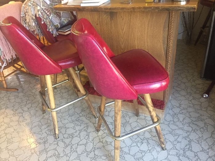 Retro red barstools and free standing bar