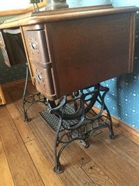 Antique sewing table with cast iron legs 