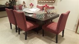 Contemporary style formica dining table with 2 leaves and 6 chairs