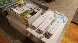 Nintendo WII with box, controllers, charging station, and games