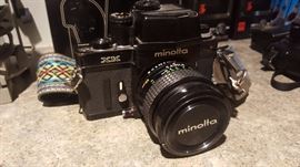 Vintage Minolta XK camera with vintage strap and various lenses, also comes with its case