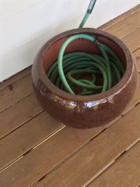 There are many of these hose storage pots